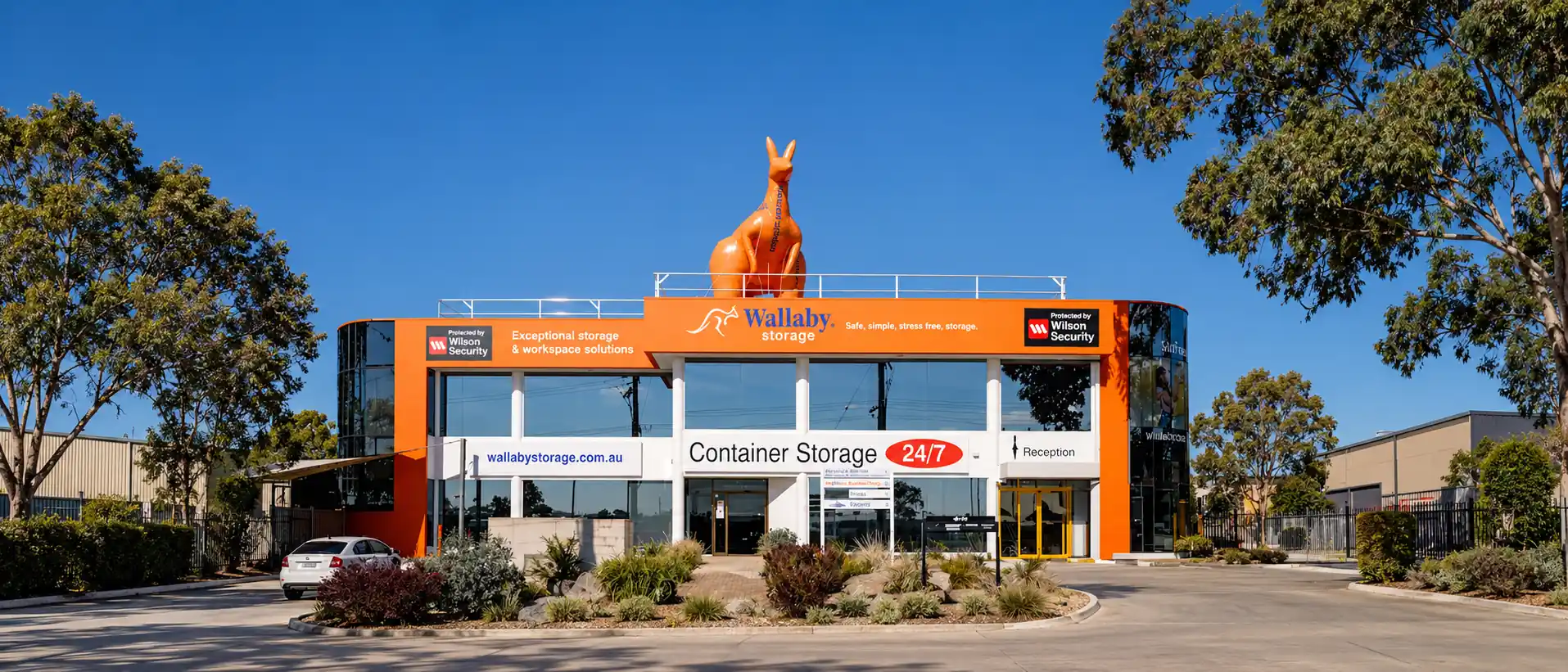 Wallaby Storage orange building facade with its rooftop wallaby statue