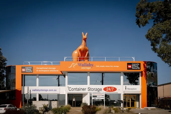 Wallaby Storage orange building facade with its rooftop wallaby statue